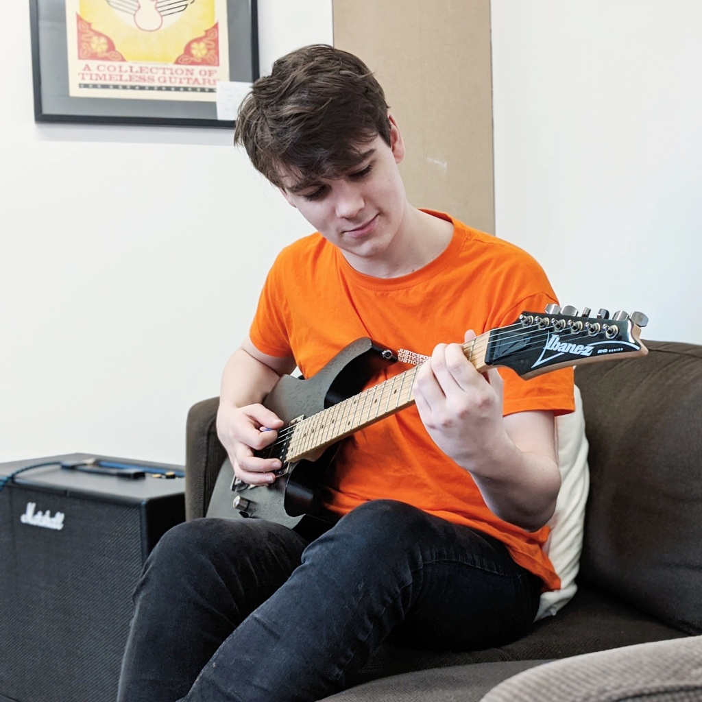 A student having his guitar lesson at The JTSCM.